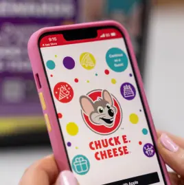 Chuck E. Cheese app on a phone