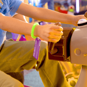 kid playing an arcade game