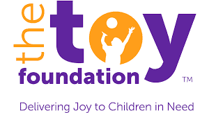 The Toy Foundation logo: "toy" in purple, orange circle in the "o" with child silhouette, text reads Delivering Joy to Children in Need.