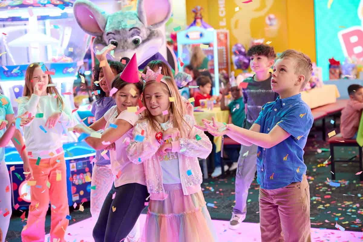 A little girl wearing a birthday crown