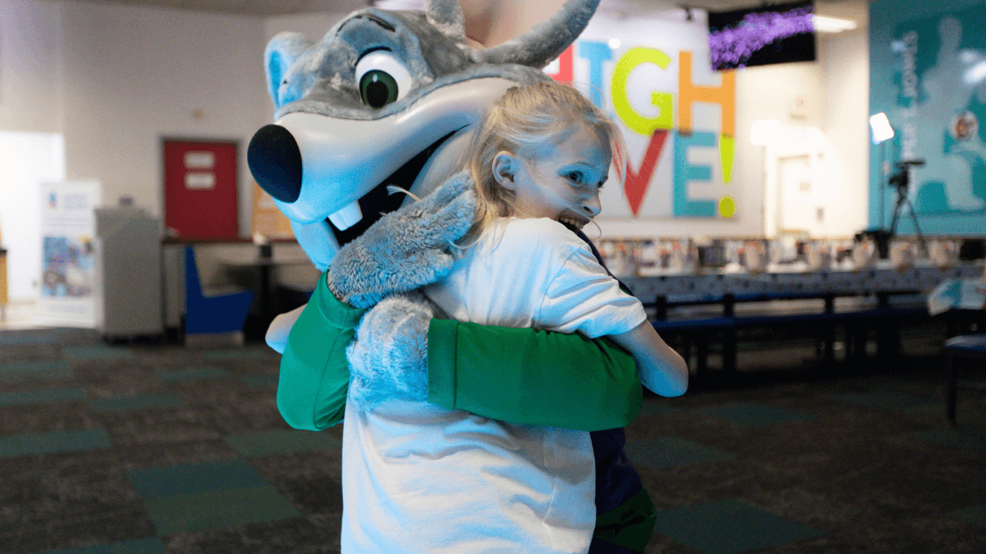 Families enjoying a sensory-friendly Chuck E. Cheese experience during Sensory Sensitive Sundays — dimmed lights, reduced sound, and a calmer game room