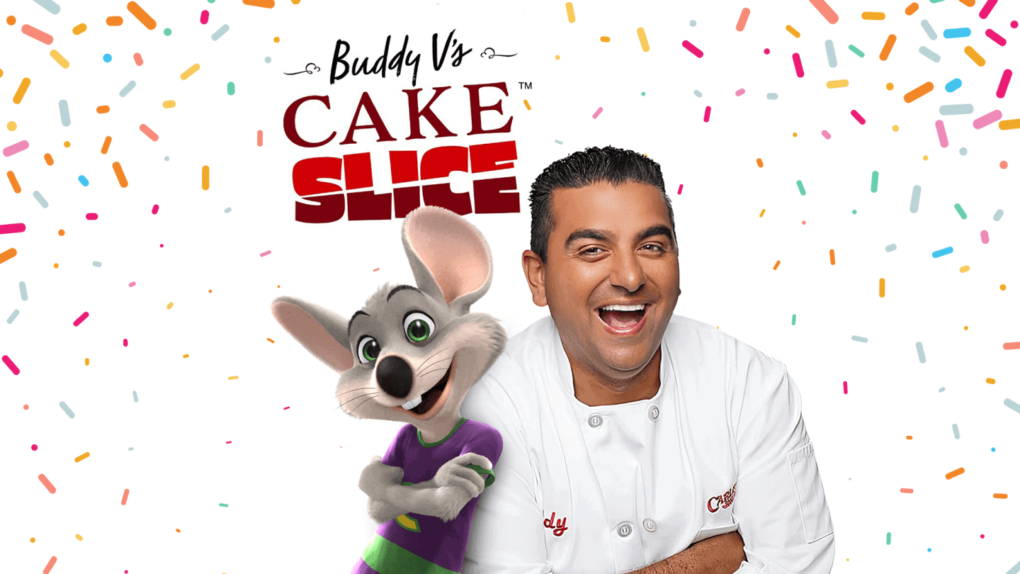 Buddy Valastro stands with Chuck E. Cheese in front of Buddy V's Cake Slice logo.