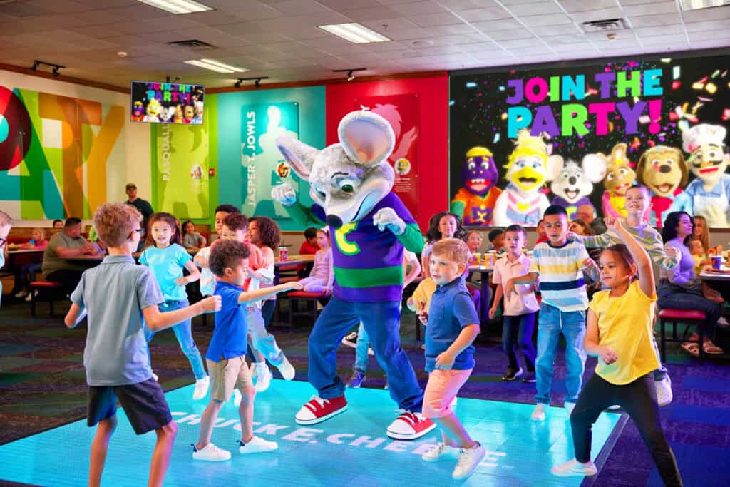 Kids dancing on the interactive dance floor at Chuck E. Cheese
