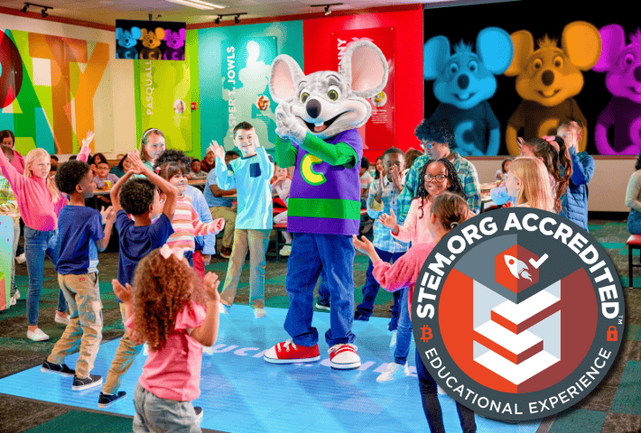 Kids at a Chuck E. Cheese education program event