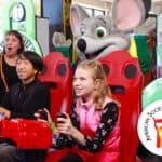 Kids play arcade games at a Chuck E. Cheese birthday party as Chuck E. cheers; Fun Pass and ASDC logo appear in the scene.