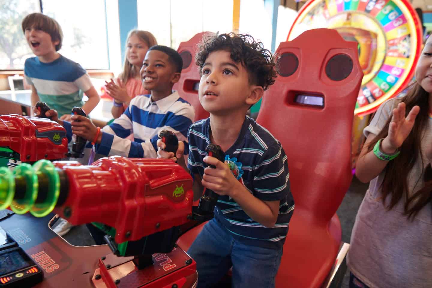 Children ages 5&ndash;10 playing arcade games at Chuck E. Cheese